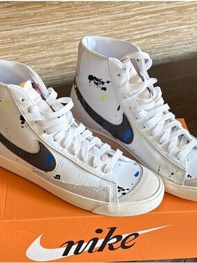 Nike White High-Top Sneakers with Black Swoosh and Paint Splatter